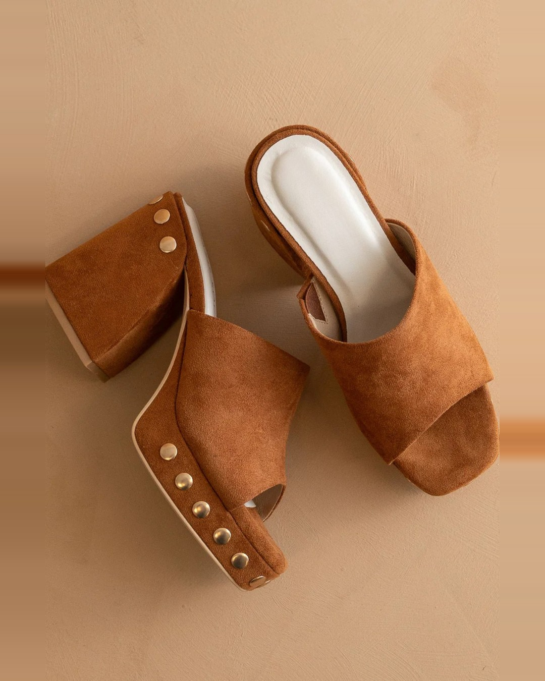 Overhead view of Oasis Society Leona caramel suede platforms with gold-tone stud trim
