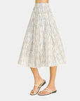 Side view of the Azure Horizon Midi Skirt showcasing the soft blue and ivory print, flattering midi-length silhouette, and lightweight woven fabric.