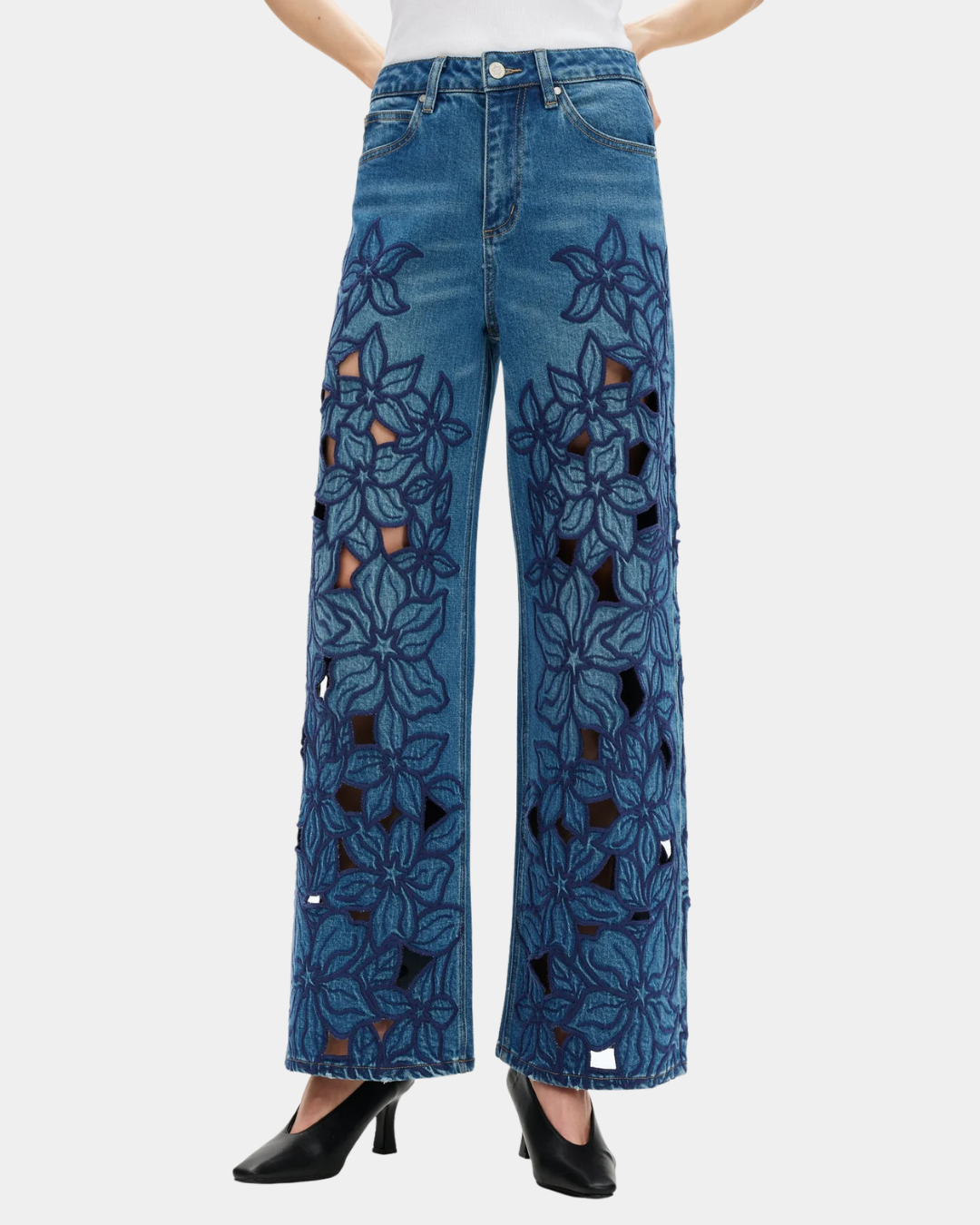 Front view of Bayeas high rise embroidered wide leg jeans in medium blue with floral cutout detailing.