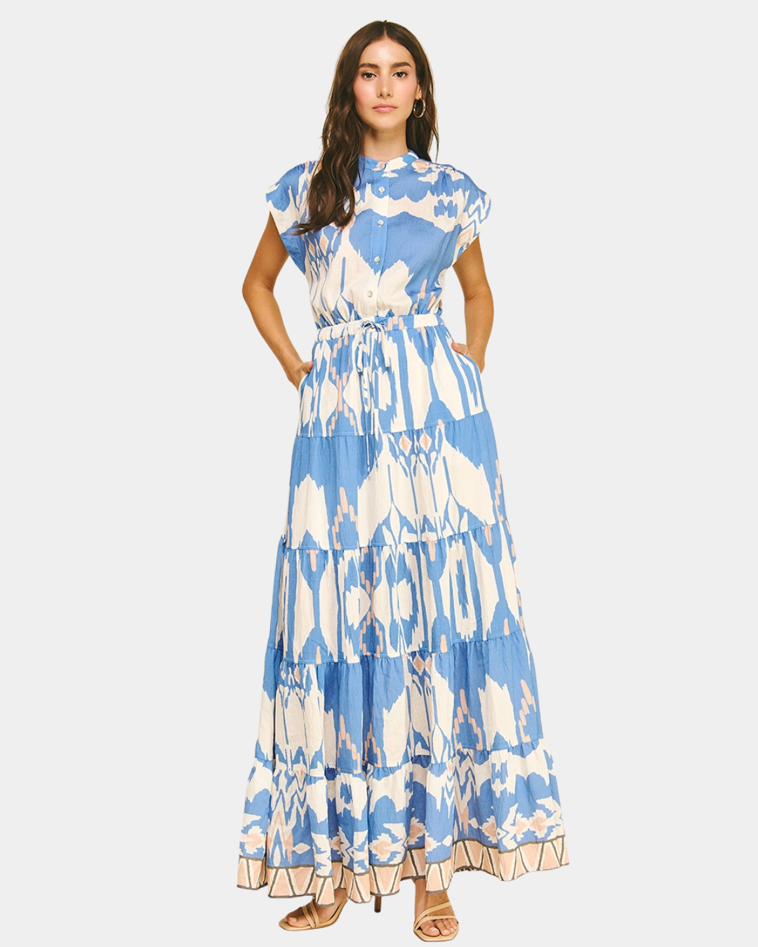 Blue ikat tiered maxi dress in motion, highlighting the flowy silhouette and lightweight fabric.