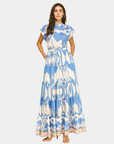 Blue ikat tiered maxi dress in motion, highlighting the flowy silhouette and lightweight fabric.