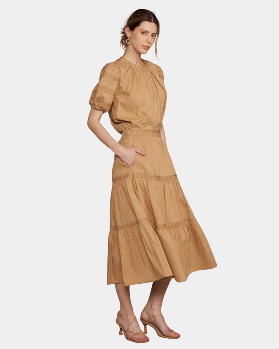 Side view of camel signature midi skirt