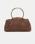Channing suede bag by Dolce Vita featuring a smooth suede finish and gold O-ring detail.
