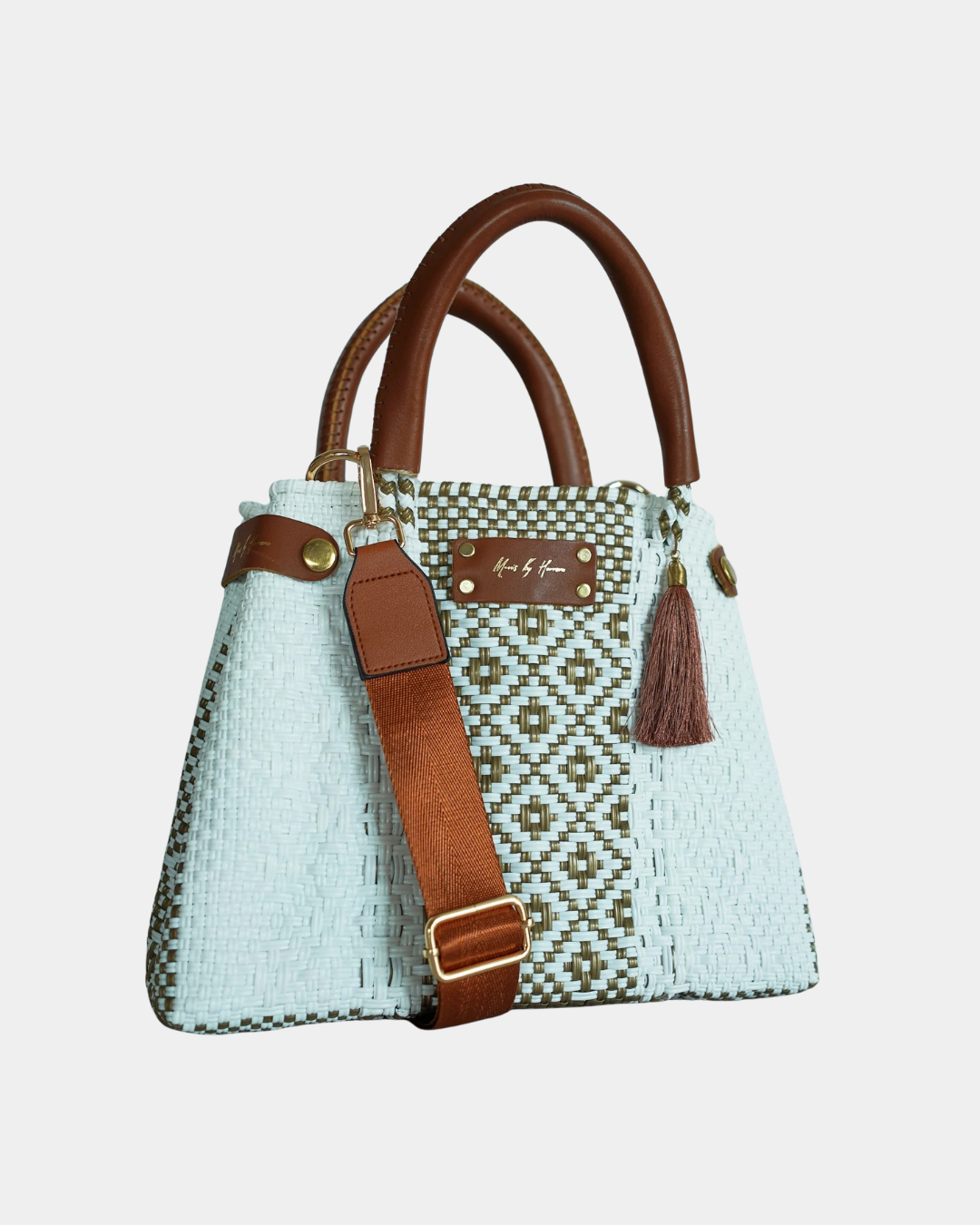 Convertible mini gold handbag worn as shoulder bag and tote