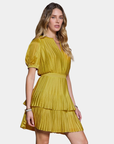 Angled view of the Current Air Colette Pleated Mini Dress in Chartreuse showing the layered skirt
