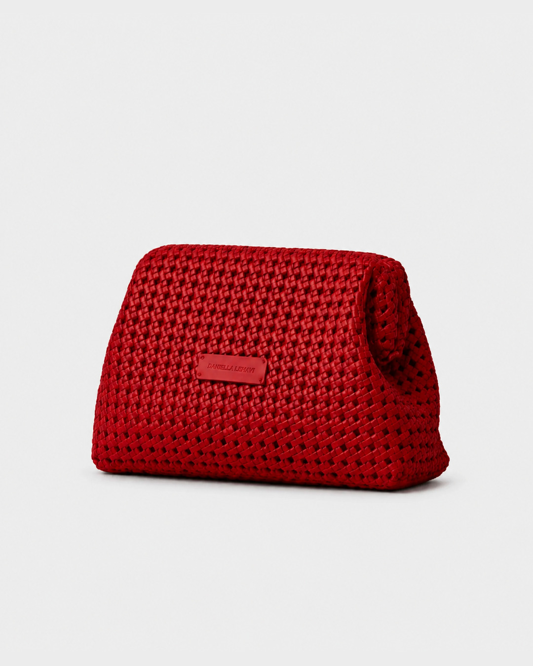 Daniella Lehavi Vivian Maxi Convertible Clutch in red, angled view showing woven texture
