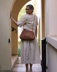 Model Wearing Daniella Lehavi Vivian Maxi Convertible Clutch Tan