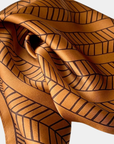 Deco caramel silk scarf tied on handbag as luxury bag accessory