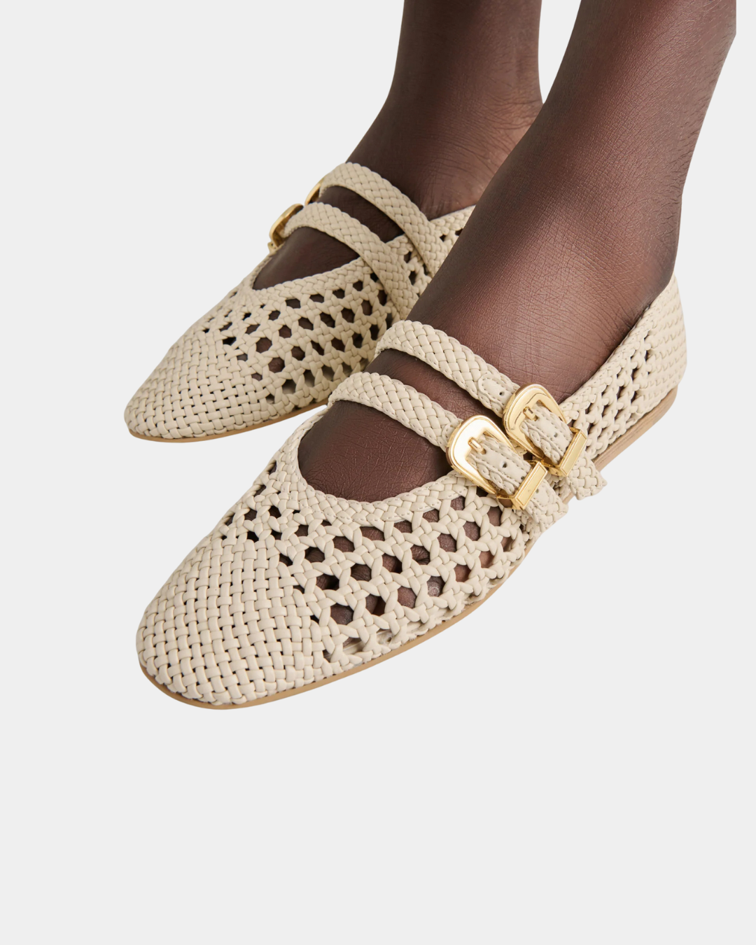 Dolce Vita Baylee women’s ballet flats featuring a woven upper and gold buckle details.