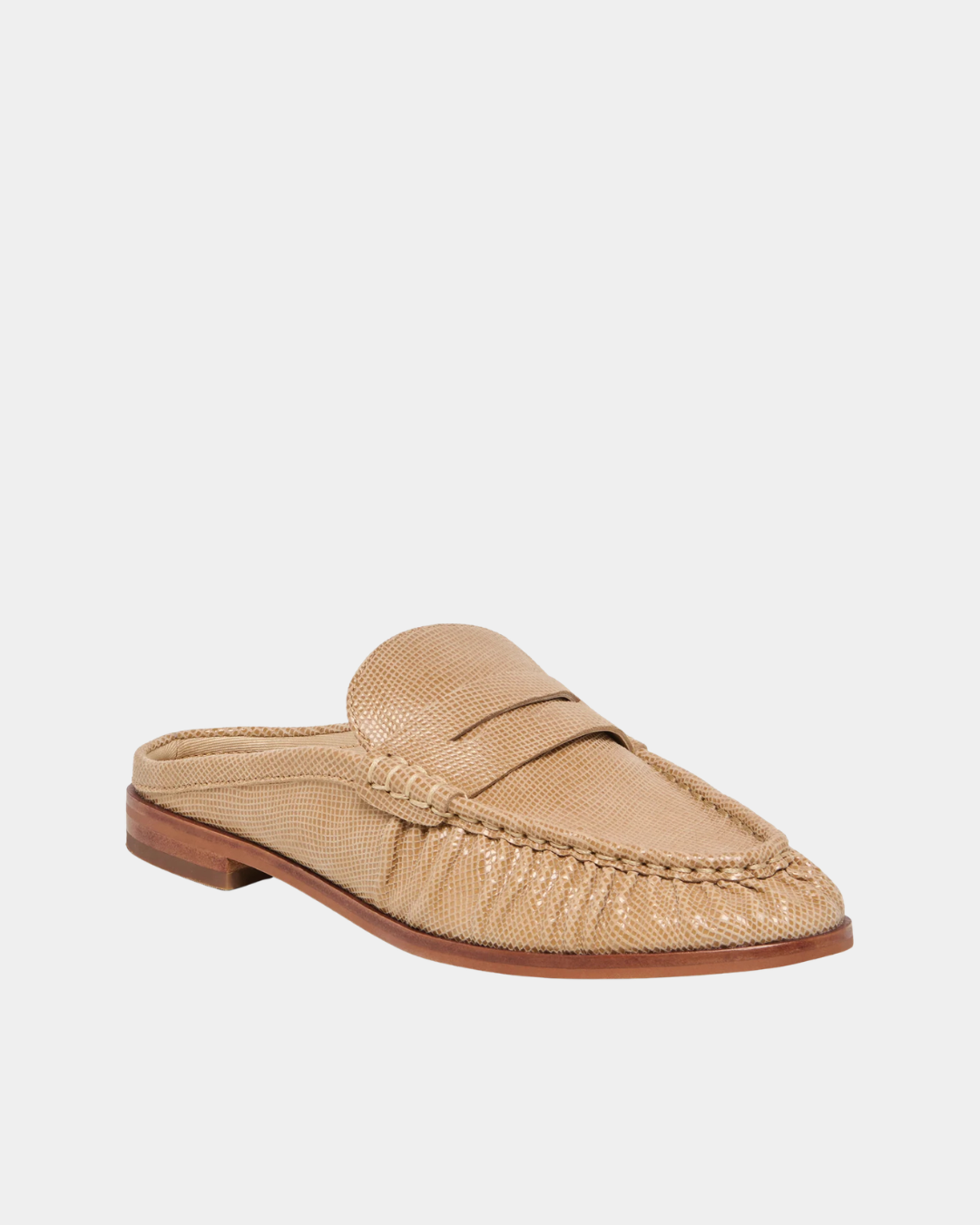 Front three-quarter view of the Dolce Vita Betzy Loafers in crème embossed suede showcasing the embossed suede texture, penny loafer vamp, and slip-on mule design.