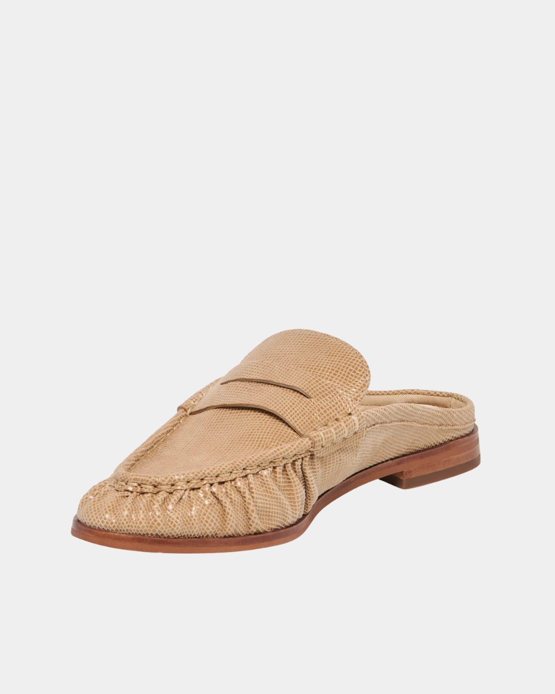 Three-quarter view of the Dolce Vita Betzy Loafers in crème embossed suede highlighting the ruched moc toe, textured suede finish, and low stacked heel.