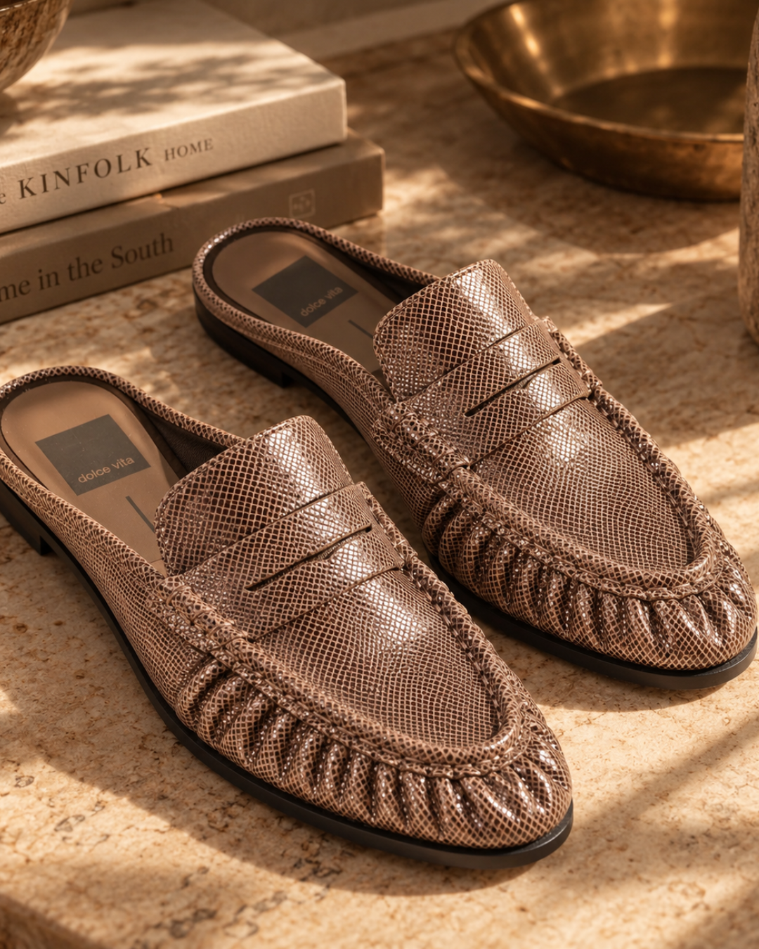 Dolce Vita Betzy Loafers in brown embossed suede styled in warm natural light.