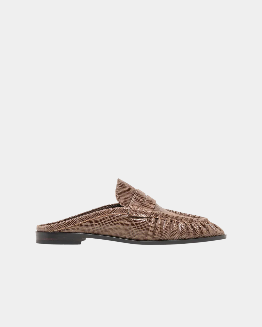 Side view of the Dolce Vita Betzy Loafer in brown embossed suede with ruched detailing and low stacked heel.