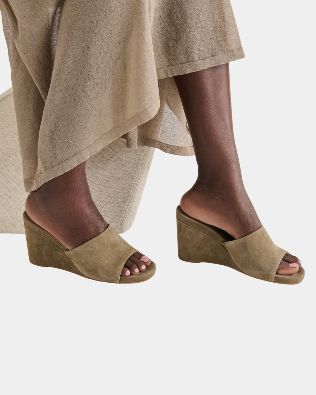 Dolce Vita Holta wedge featuring a clean silhouette and rich olive suede finish.
