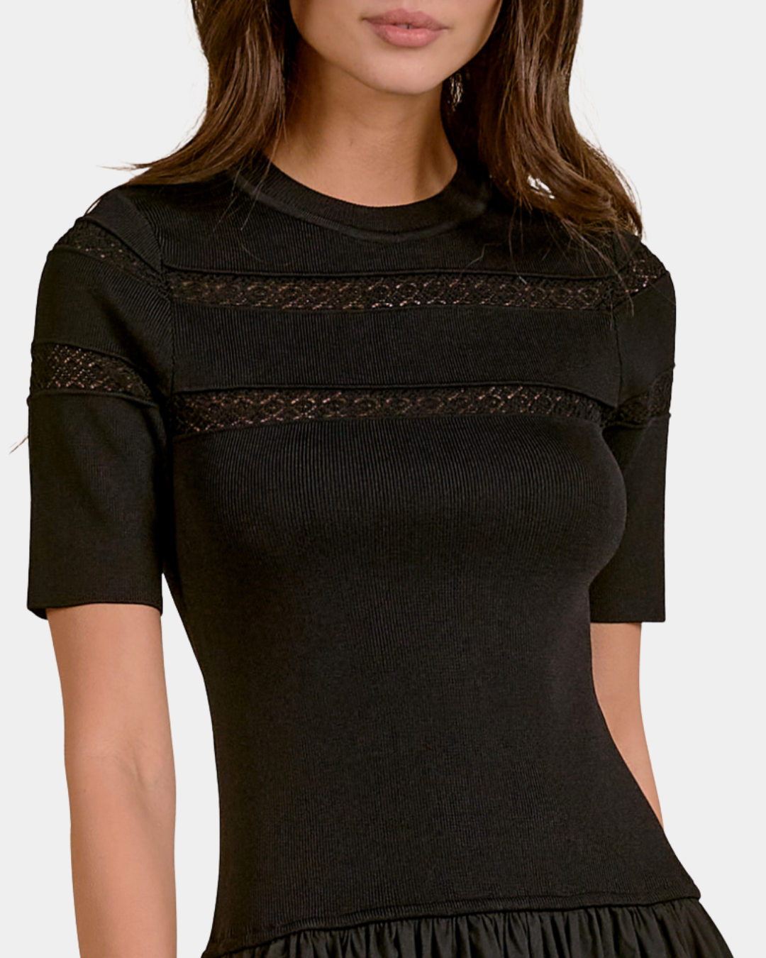 Close-up of the Elan Ember black midi dress showing the knit bodice and delicate open-knit yoke detailing.
