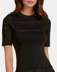 Close-up of the Elan Ember black midi dress showing the knit bodice and delicate open-knit yoke detailing.