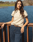 Elan Sam Short Sleeve Sweater in Stone styled with patterned denim