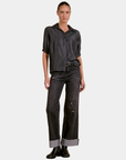 Elan Washed Denim Button Down Shirt in Black styled with cuffed black jeans