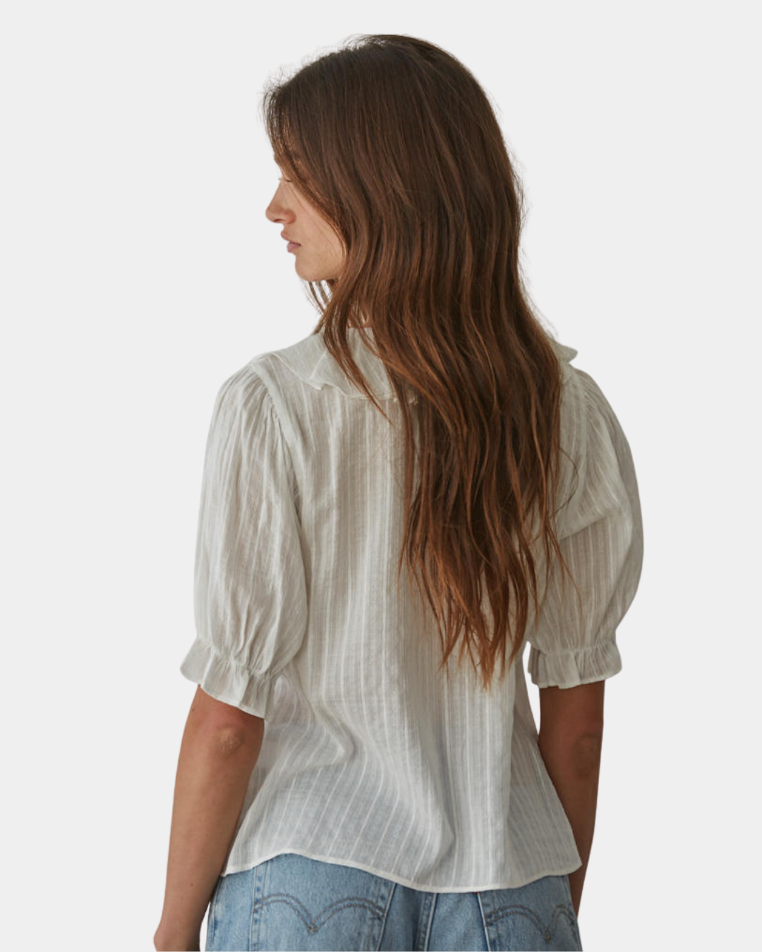 Back view of the Élodie ruffle front blouse with an airy, feminine drape.