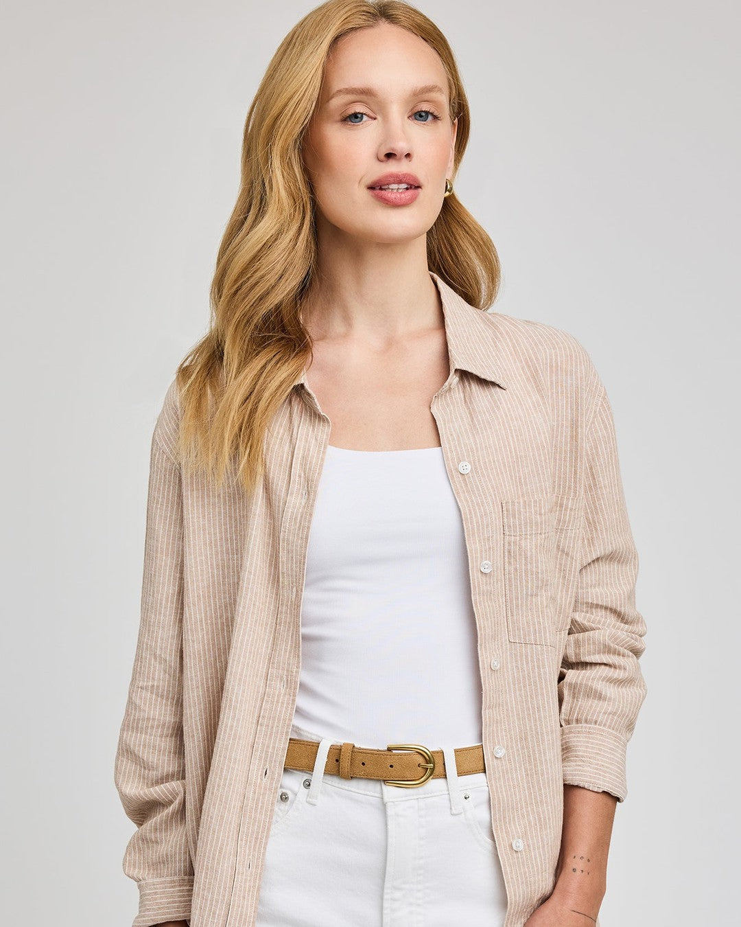 Gentle Fawn Dominique striped button down shirt in beechwood worn open over a white tank with white jeans