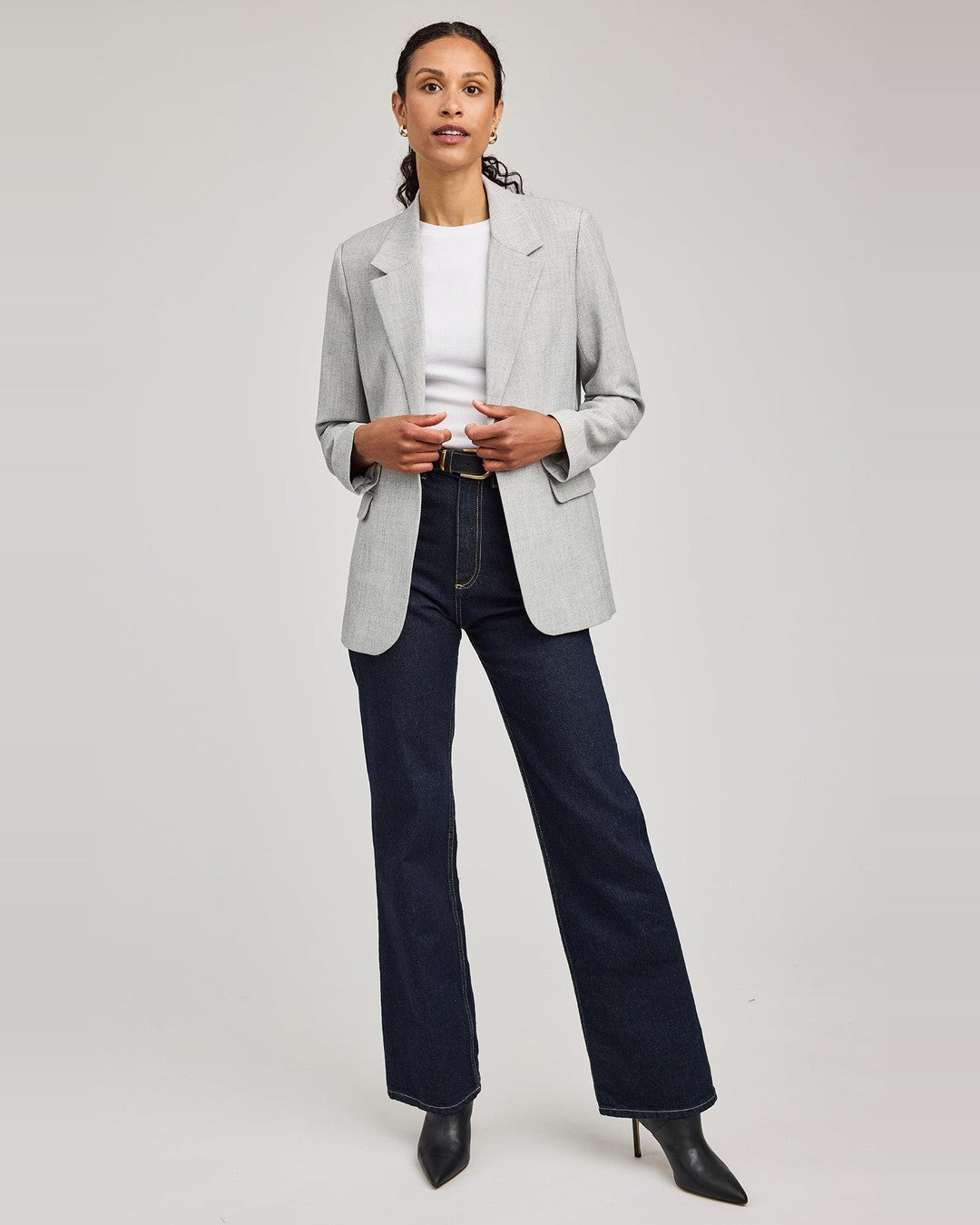 Full-length view of the heather ash Jeanie Blazer styled with a white tee, dark wide-leg jeans and black boots
