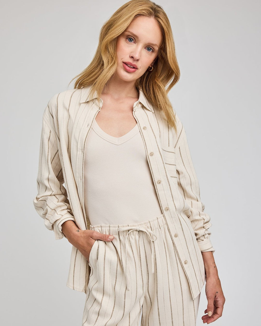 Gentle Fawn Portia striped linen shirt worn open over a cream tank with matching Finley linen pants