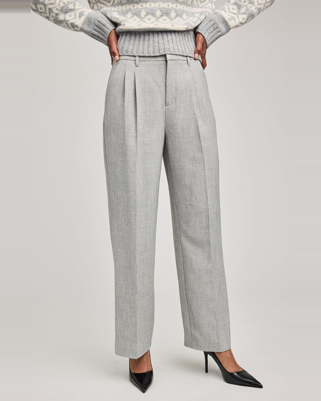 Gentle Fawn Trina Pants in heather grey with front pleats, worn with a Fair Isle sweater and black heels