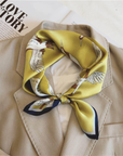Golden crane mulberry silk scarf styled around the neck