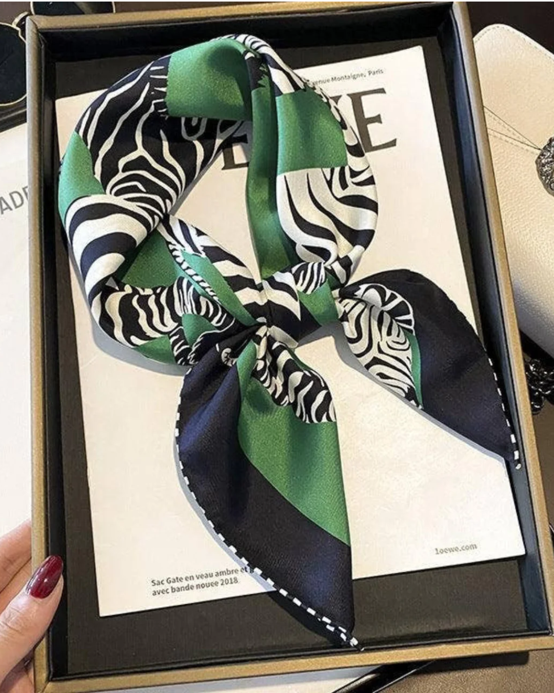Green zebra print mulberry silk scarf styled around the neck