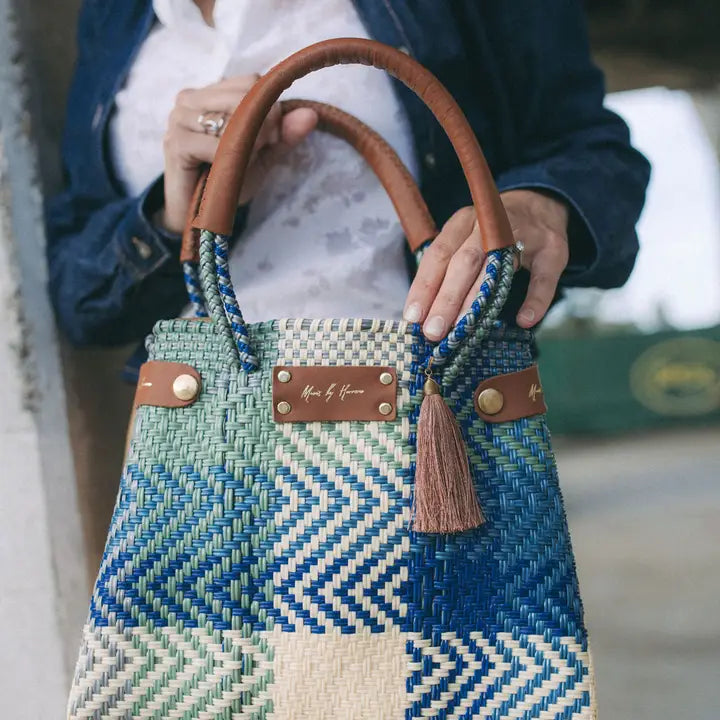 Handcrafted details on a mini azure sustainable handbag