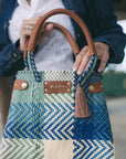 Handcrafted details on a mini azure sustainable handbag