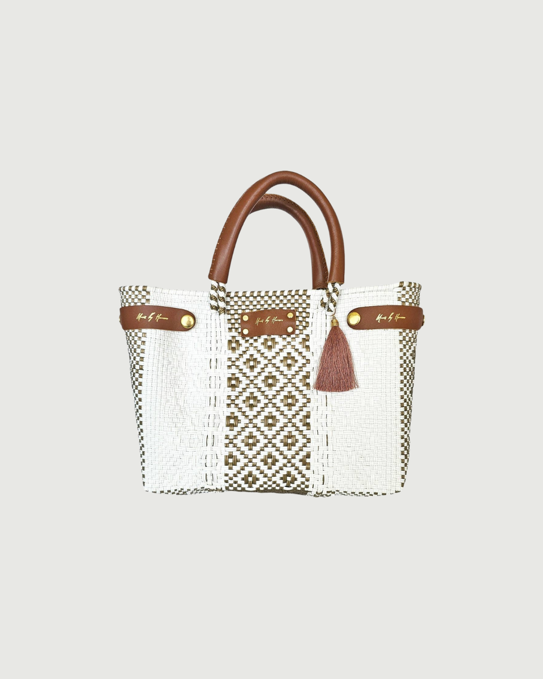 Handcrafted details on a mini gold sustainable handbag