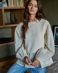 Heirloom knit layered blouse with puff sleeves and textured overlay