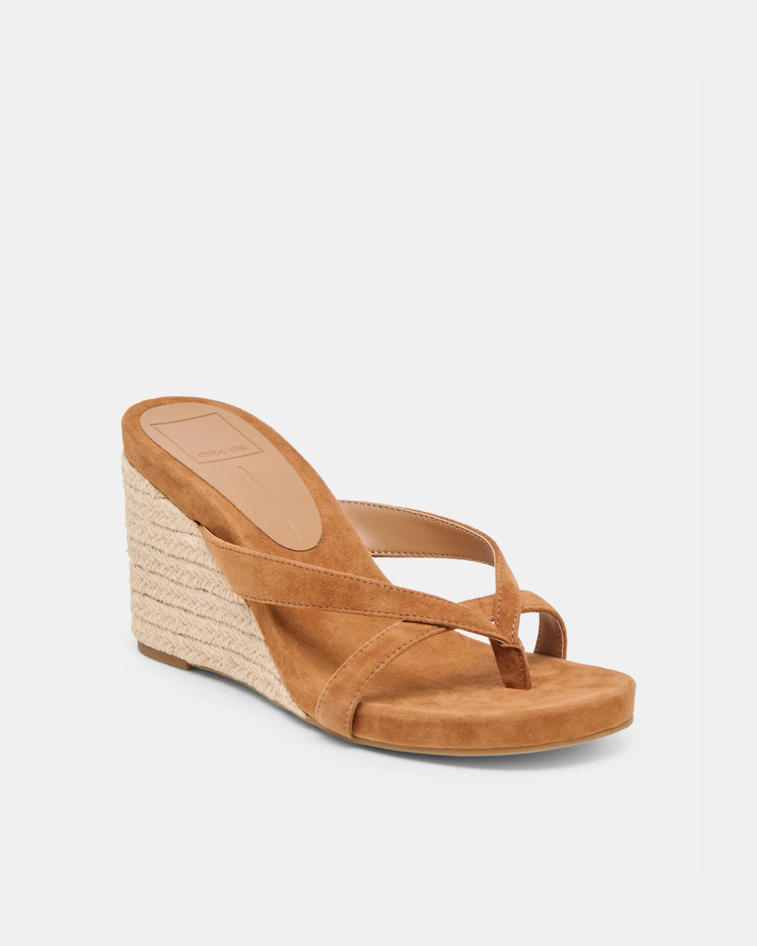 Helan espadrille wedge by Dolce Vita crafted in brown suede with a minimalist thong silhouette.