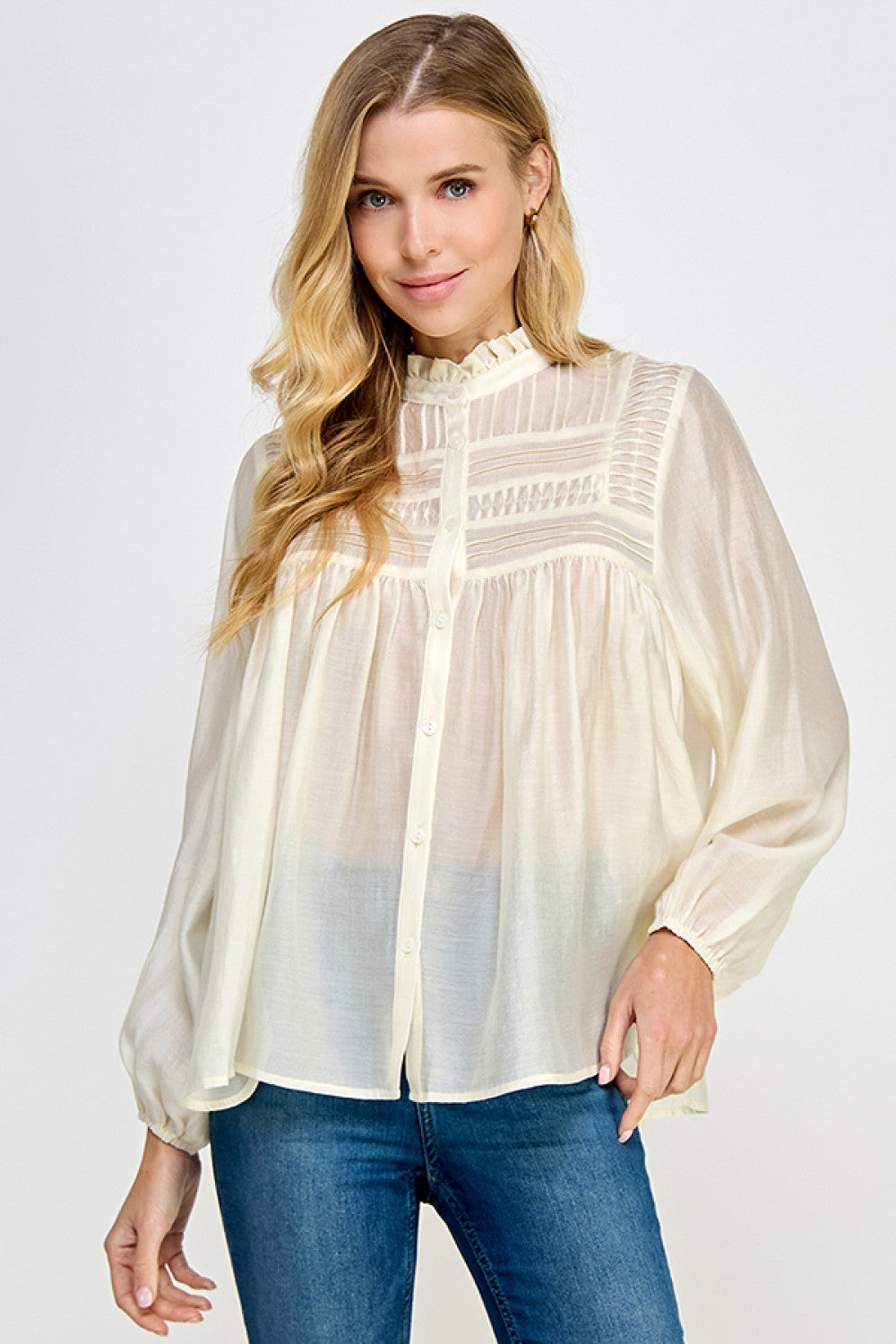 Ivory sheer pintuck ruffle blouse with long sleeves and button front