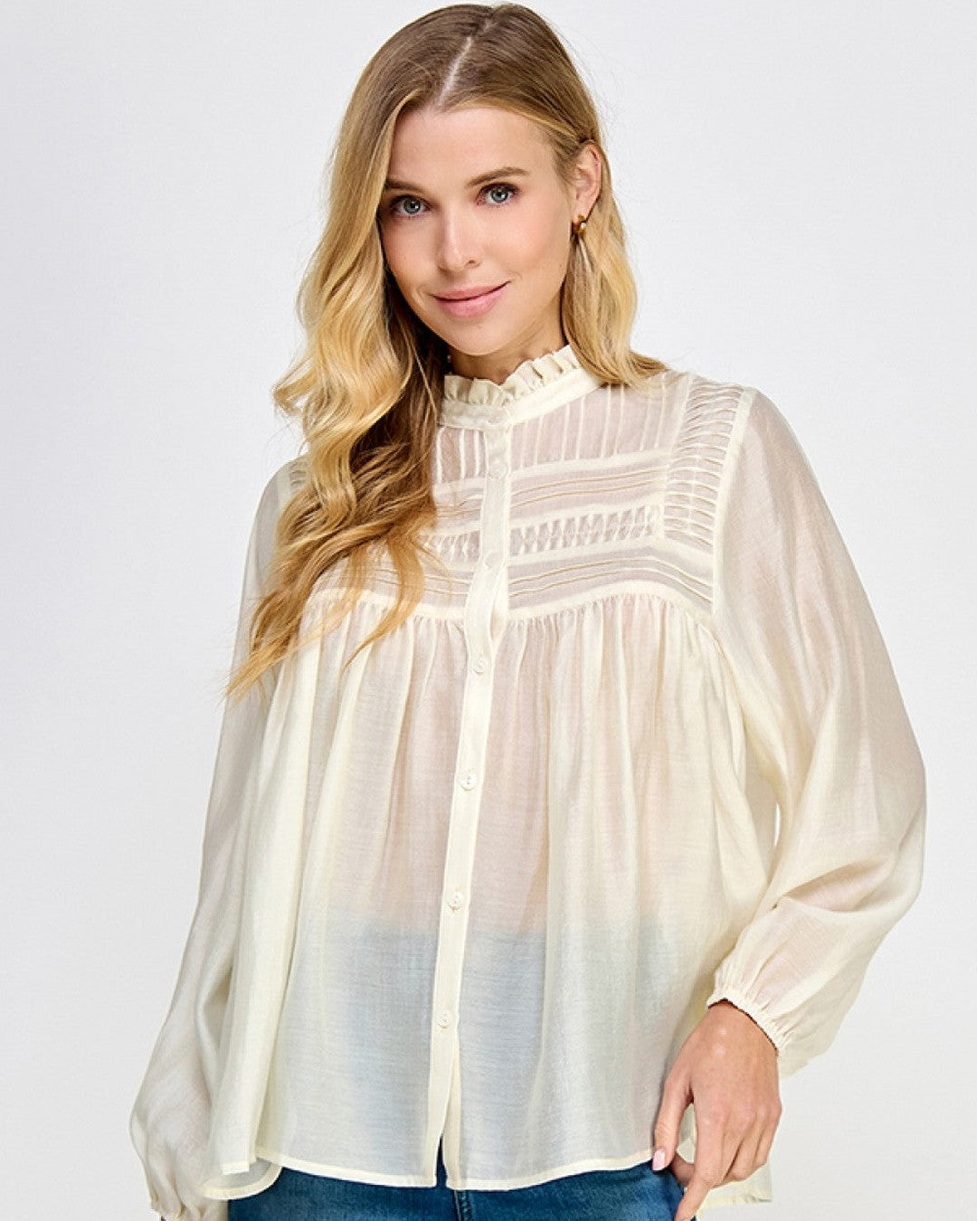 Ivory sheer pintuck ruffle blouse with long sleeves and button front