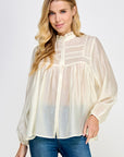 Ivory sheer pintuck ruffle blouse with long sleeves and button front