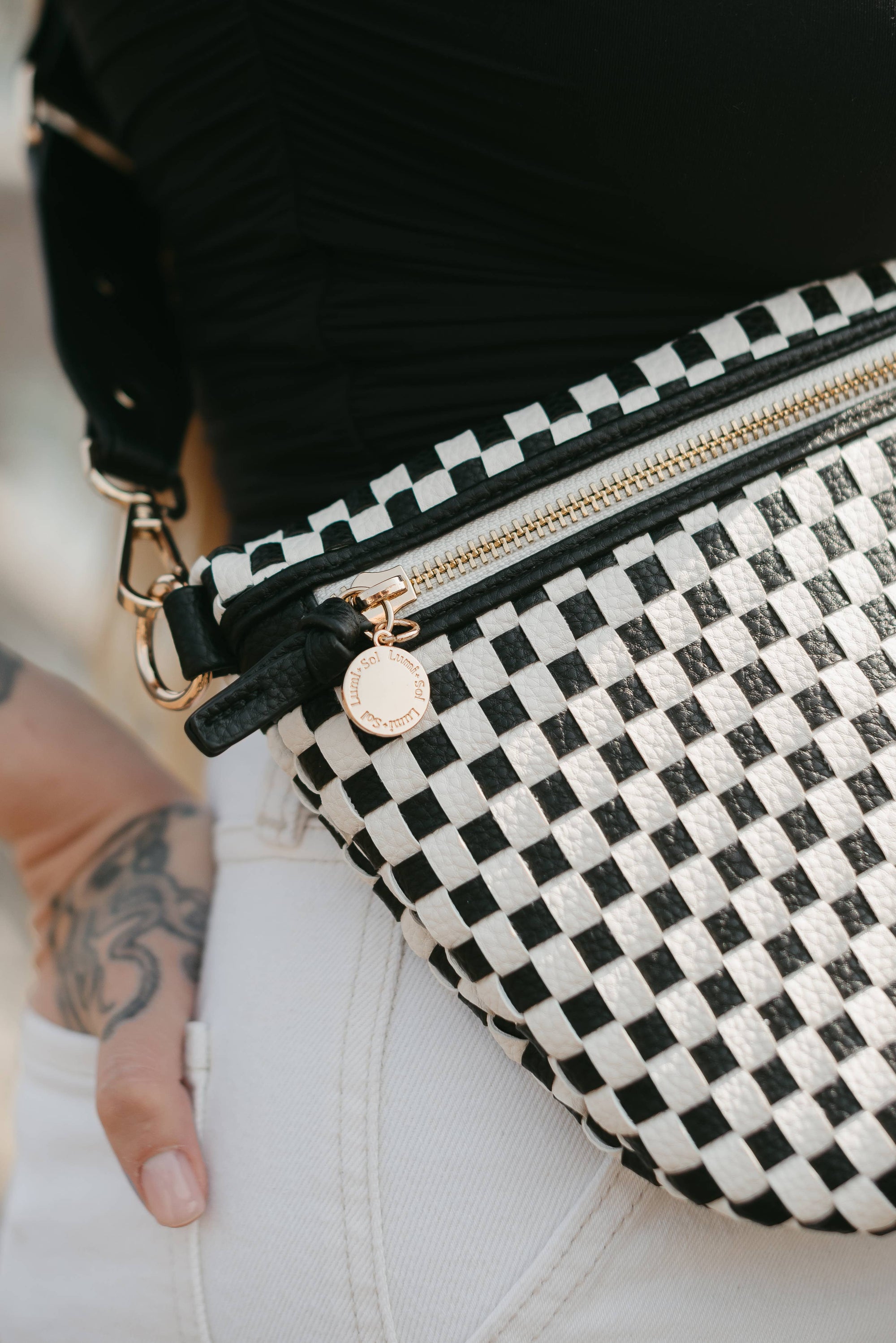 Close-up of black checkered woven vegan leather texture