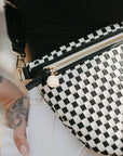 Close-up of black checkered woven vegan leather texture