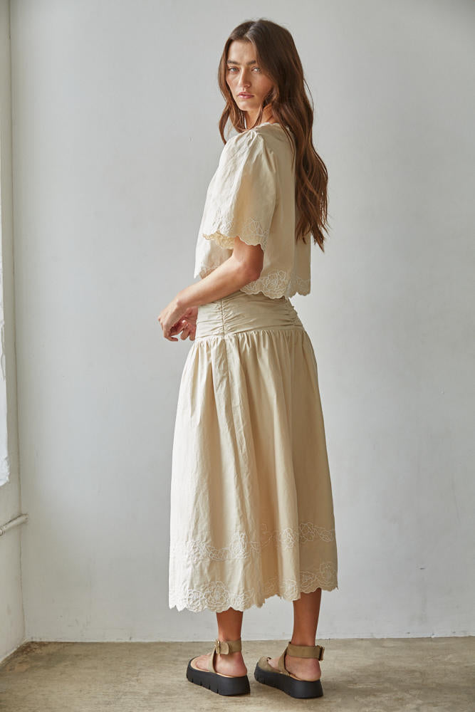 The Maison embroidered puff sleeve blouse styled with the matching skirt for a polished coordinated look.