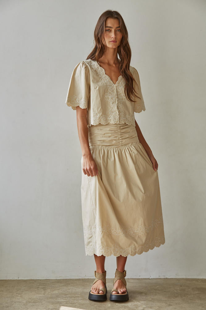 The Maison embroidered puff sleeve blouse styled with the matching skirt for a polished coordinated look.