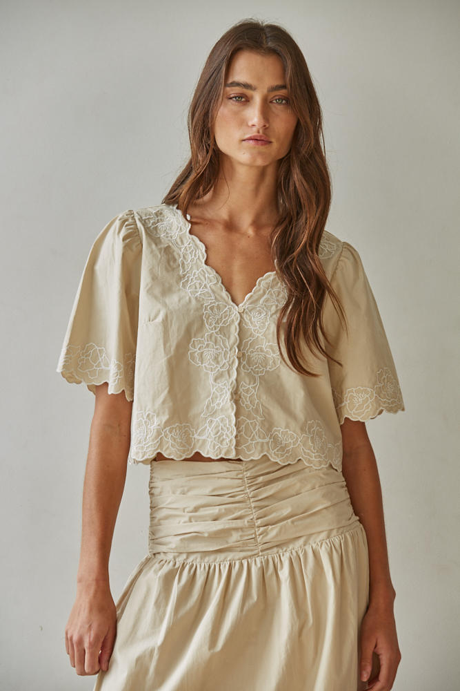 Front view of the Maison embroidered puff sleeve blouse in lightweight cotton with a feminine silhouette.