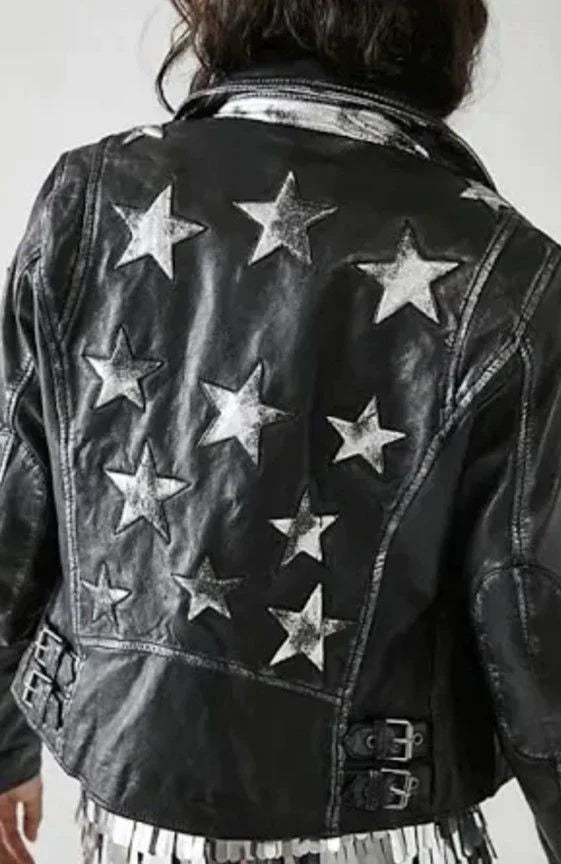Woman wearing the Mauritius Christy Black Star Leather Jacket in a lifestyle setting, featuring distressed lambskin leather, silver star detailing, and a classic moto silhouette