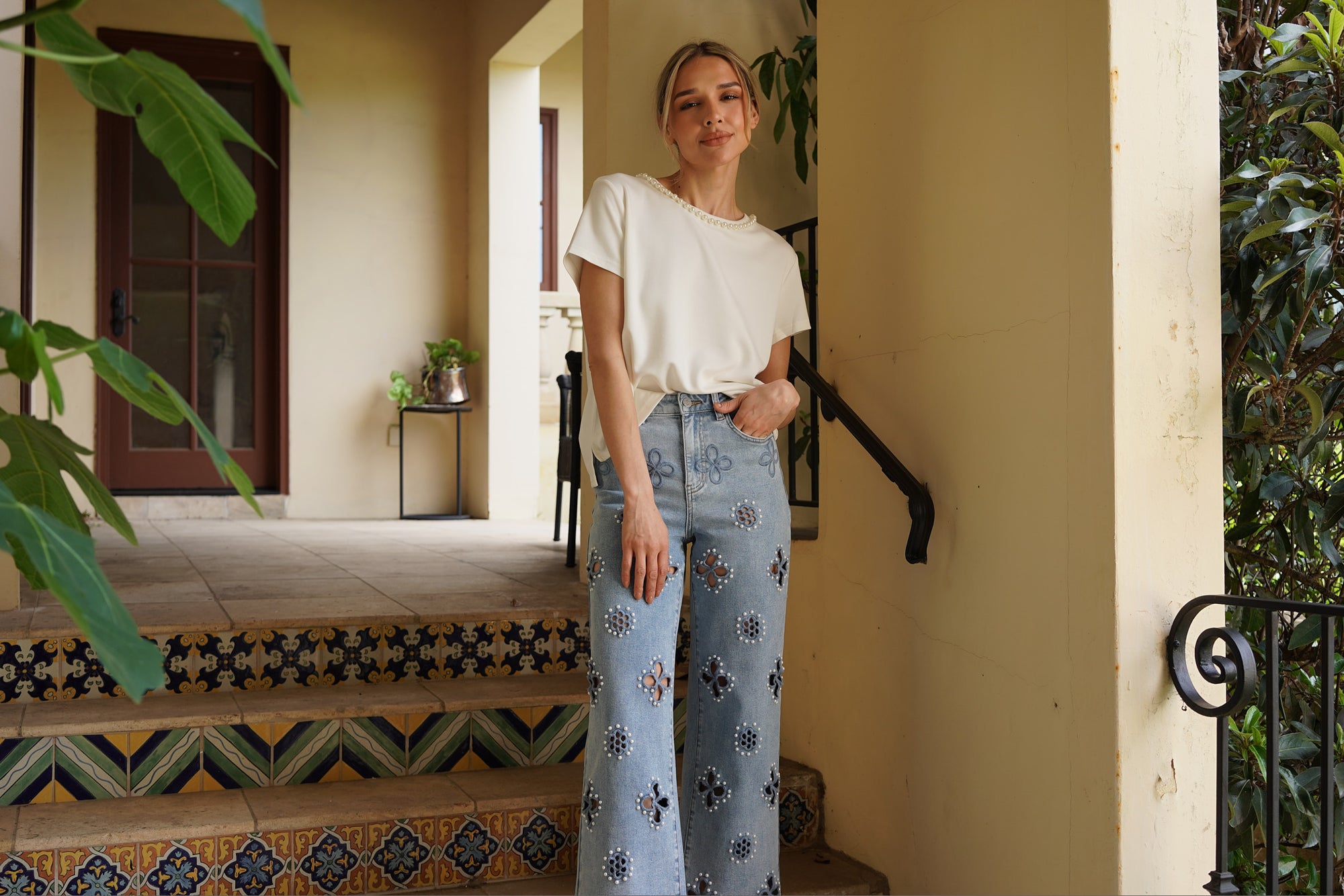 Monaco Pearl Trim Tee in ivory featuring an elegant pearl-trim neckline and relaxed short sleeve silhouette.