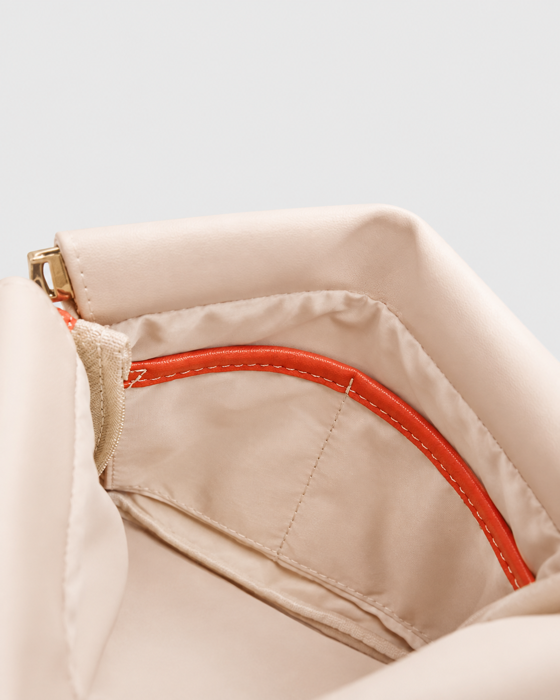 Montemare Roma Square Pouch in Ivory, interior view with orange trim and interior pocket.