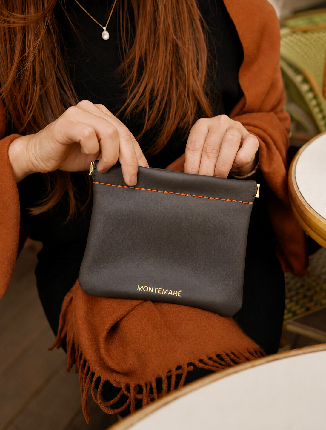 Montemare Roma Square Pouch in Slate shown in a lifestyle setting.