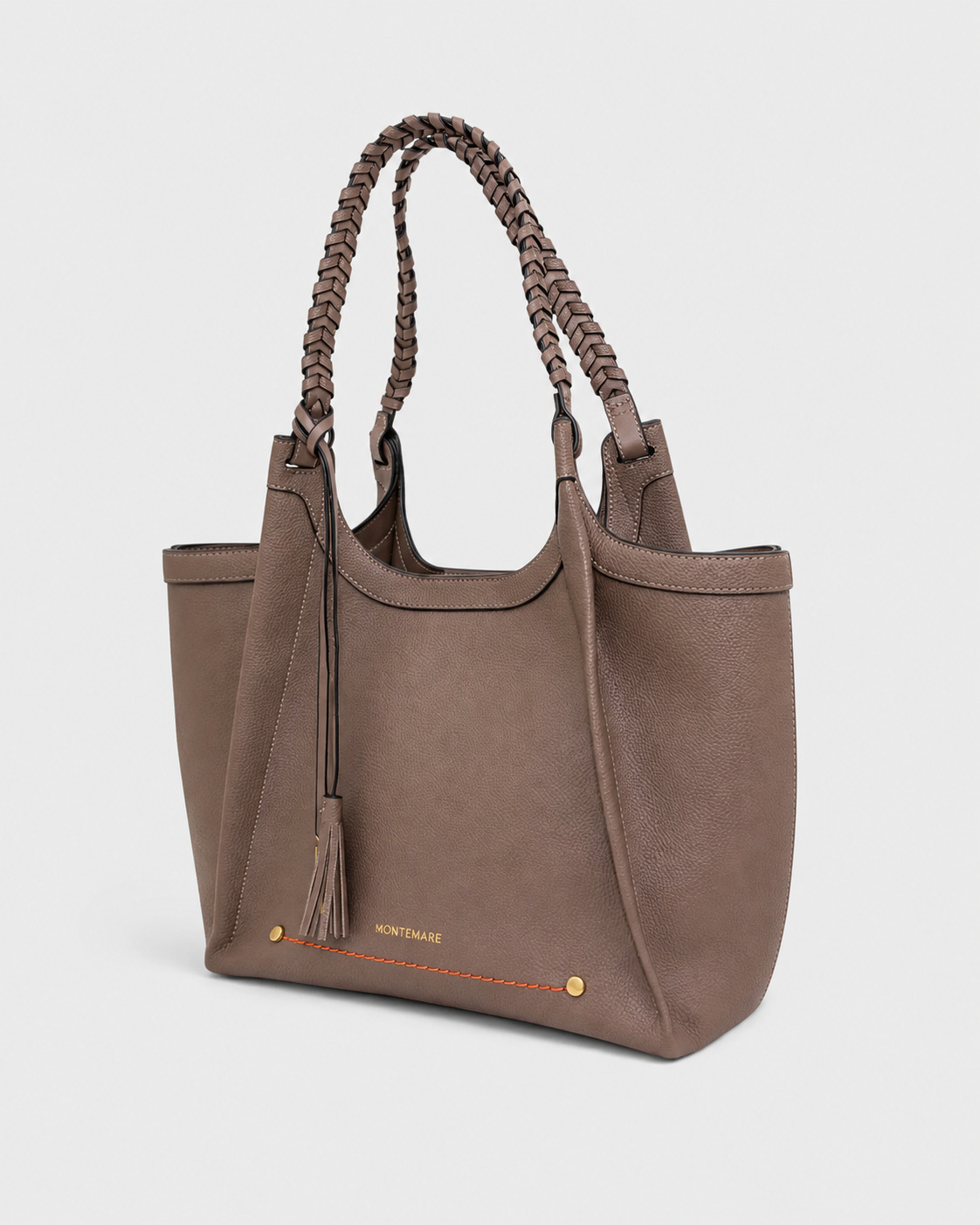 Montemare Sedona Tote in Cocoa Bean angled view with braided handles and tassel detail