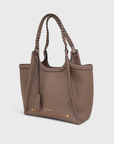 Montemare Sedona Tote in Cocoa Bean angled view with braided handles and tassel detail