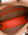 Interior of Montemare Vienna Carry-On in Latte showing orange contrast lining and zippered interior pocket