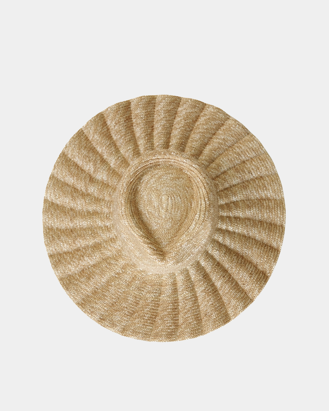 Close-up view of the Nalu natural hat crafted from 100% golden wheat straw.